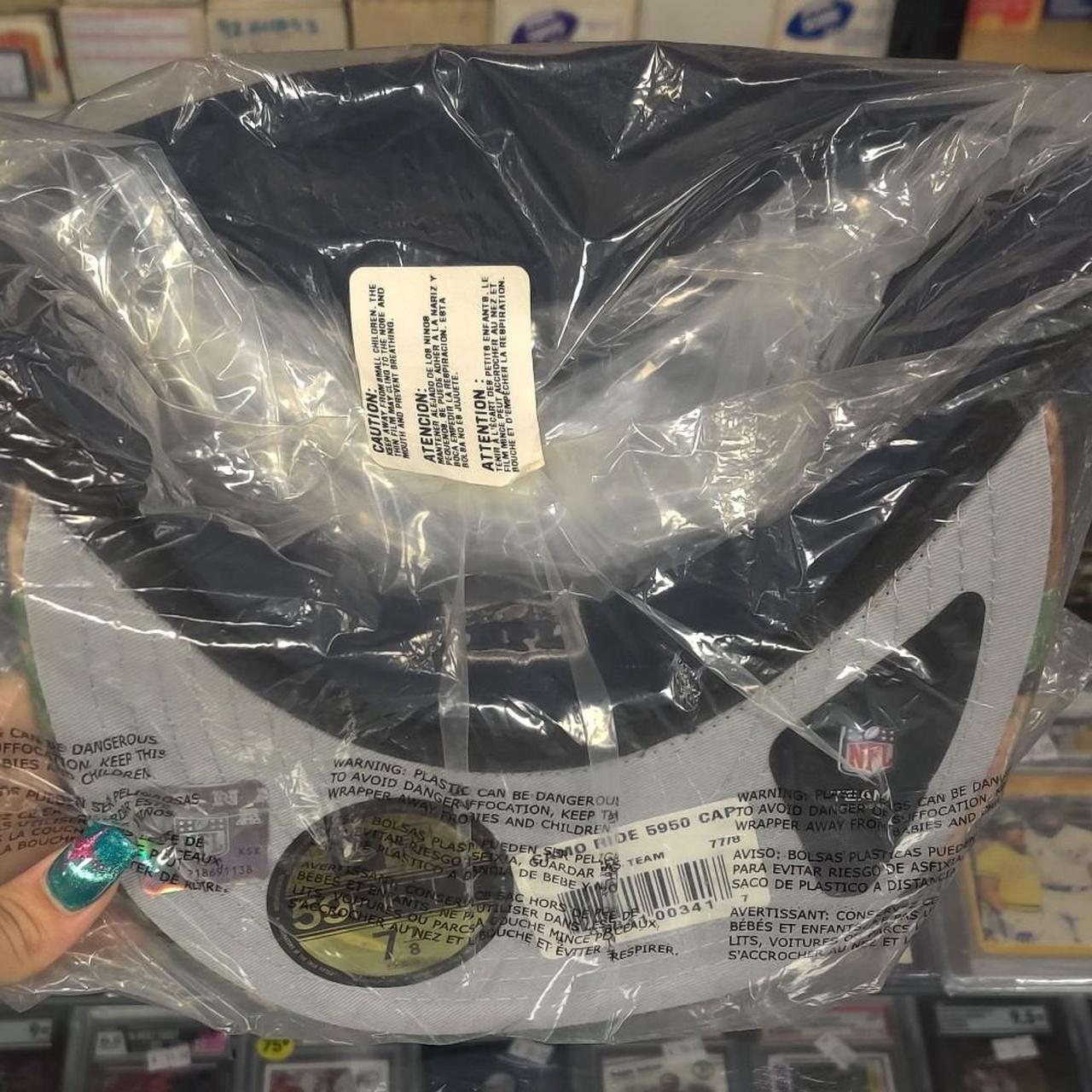 Dallas Cowboys 59FIFTY cap with white star logo on navy blue background with camouflage pattern on the brim #cowboys #nfl