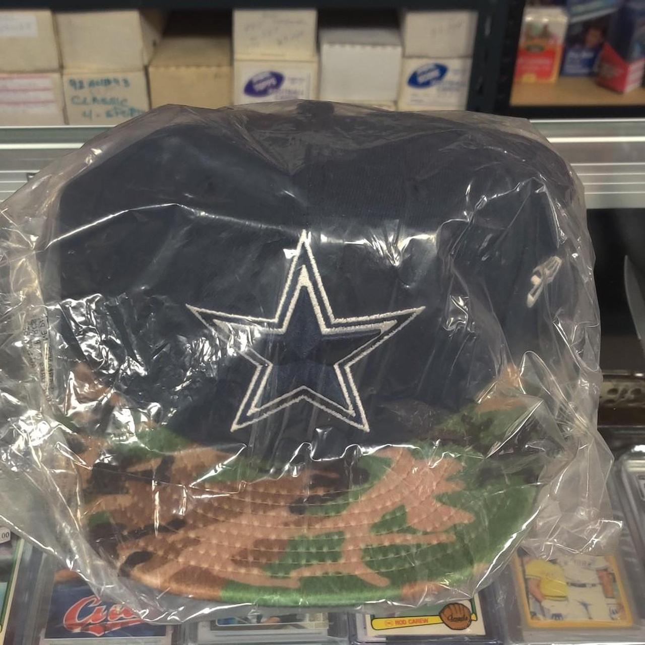 Dallas Cowboys 59FIFTY cap with white star logo on navy blue background with camouflage pattern on the brim #cowboys #nfl